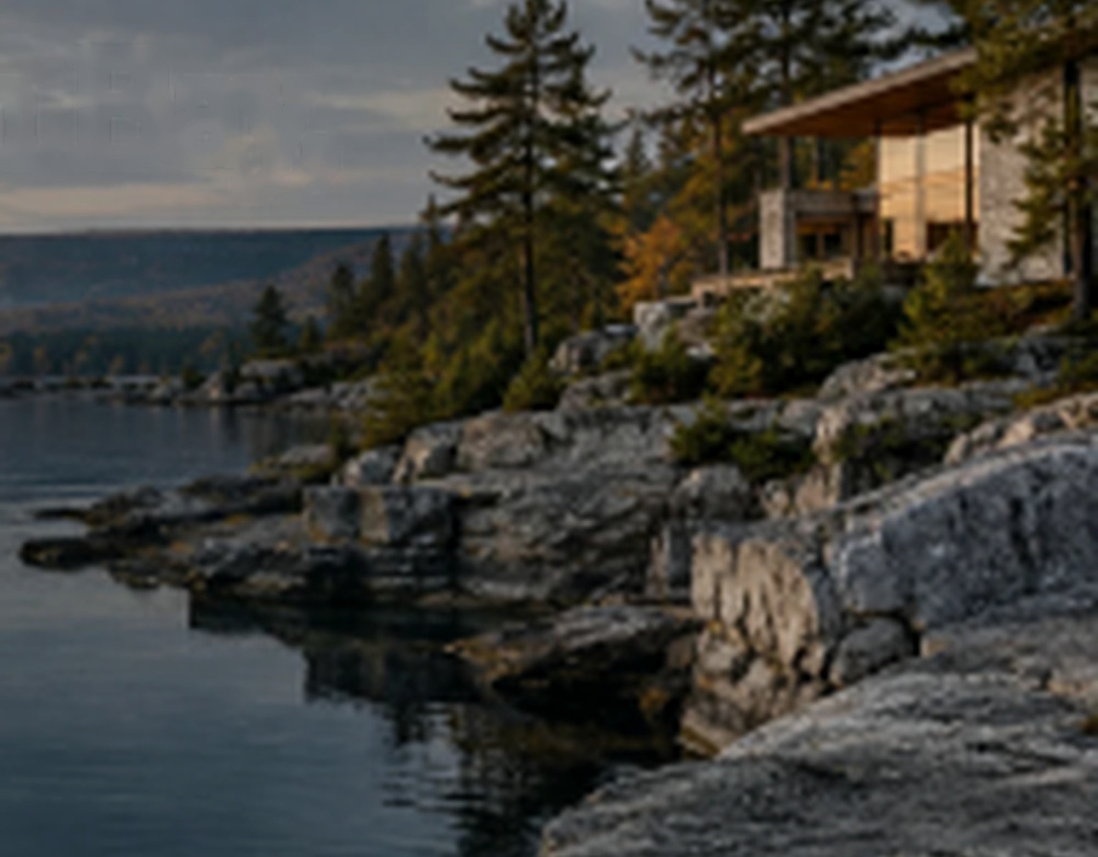 Architectural home above a rocky waterfront; concept image, not a Westmere listing